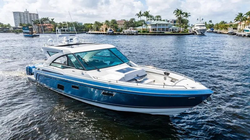 Slide: The Image of 2019 Formula 430 All Sport Crossover boat cruising on a sunny waterfront. - 10