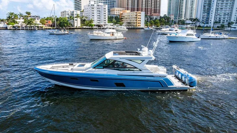 Slide: The Image of 2019 Formula 430 All Sport Crossover yacht cruising in a bustling marina. - 12