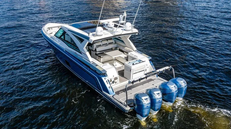 Slide: The Image of 2019 Formula 430 All Sport Crossover boat on water, featuring triple outboard engines. - 14