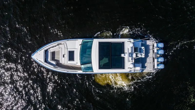 Slide: The Image of Aerial view of 2019 Formula 430 All Sport Crossover boat cruising on water. - 21
