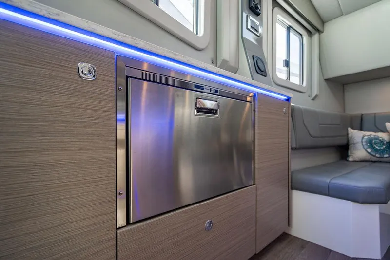 Slide: The Image of 2019 Formula 430 All Sport Crossover interior with modern kitchen and seating area. - 32
