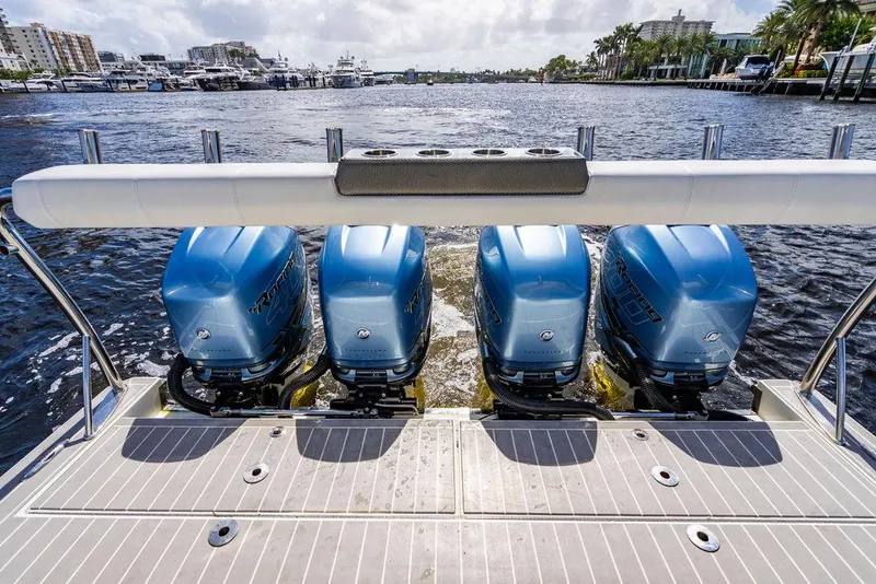 Slide: The Image of Four blue outboard motors on a 2019 Formula 430 All Sport Crossover boat. - 48