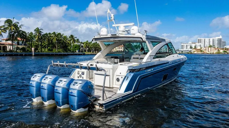 Slide: The Image of 2019 Formula 430 All Sport Crossover boat on water, featuring four powerful outboard engines. - 7