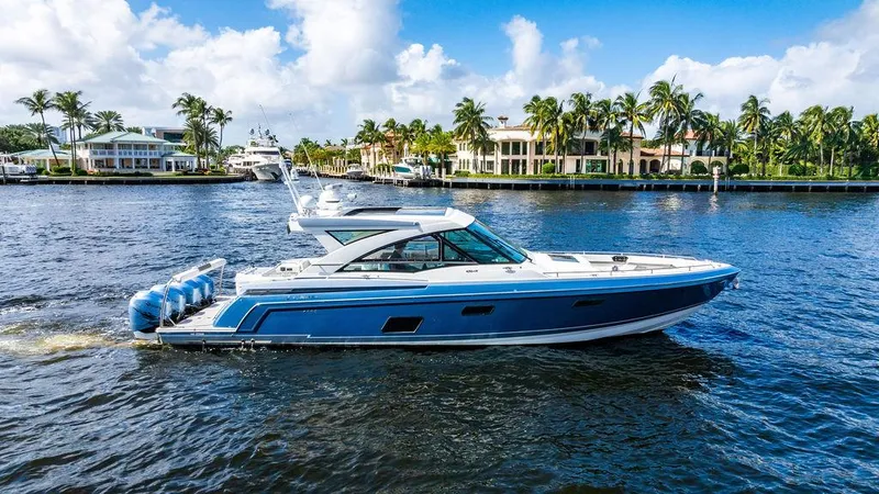 Slide: The Image of 2019 Formula 430 All Sport Crossover boat cruising on a scenic waterway. - 8