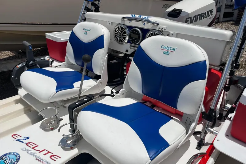 Slide: The Image of 2016 CraigCat E2 Elite with blue and white seats, featuring dual controls and cup holders. - 3