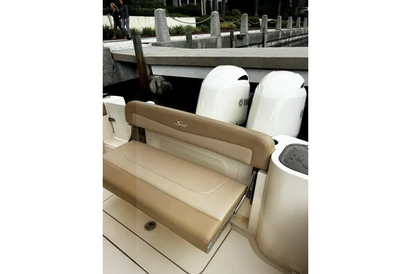 Slide: The Image of 2019 Scout 255 LXF boat with beige seating and dual Yamaha engines. - 6