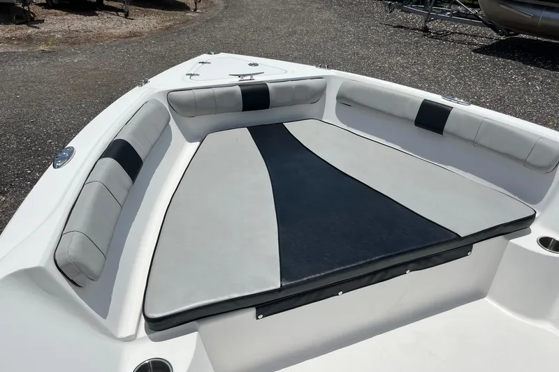 Slide: The Image of 2022 K2 Marine boat interior with cushioned seating and sleek design. - 5