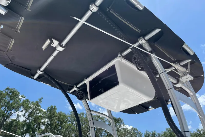 Slide: The Image of 2022 K2 Marine boat canopy with speakers and lights under clear blue sky. - 7