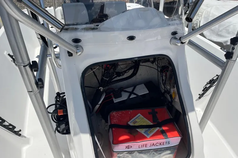 Slide: The Image of 2022 K2 Marine boat interior with life jackets and equipment storage. - 9