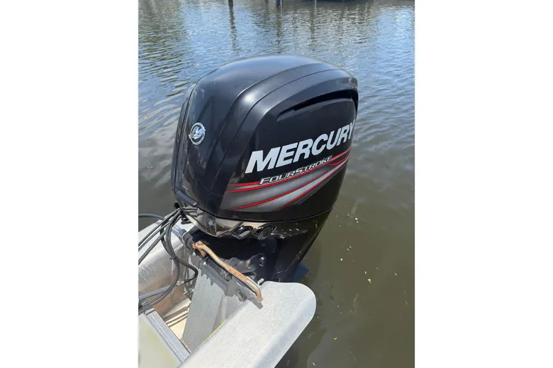 Slide: The Image of Mercury FourStroke engine on 2019 Sun Tracker Party Barge 20 DLX in water. - 13