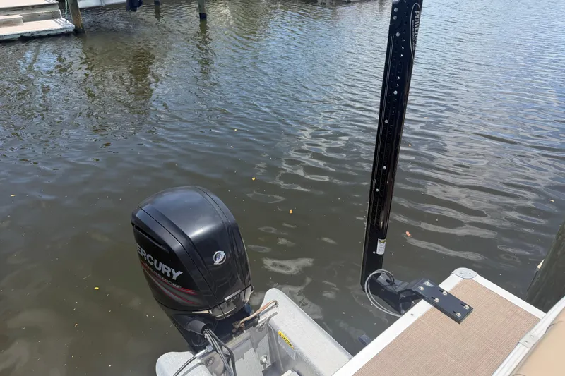 Slide: The Image of 2019 Sun Tracker Party Barge 20 DLX with Mercury outboard motor on water. - 14