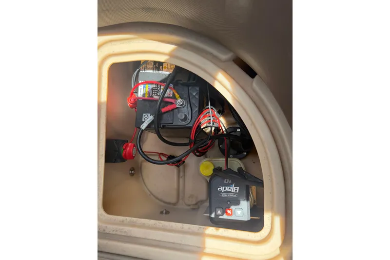 Slide: The Image of 2019 Sun Tracker Party Barge 20 DLX battery compartment with wiring and components. - 15