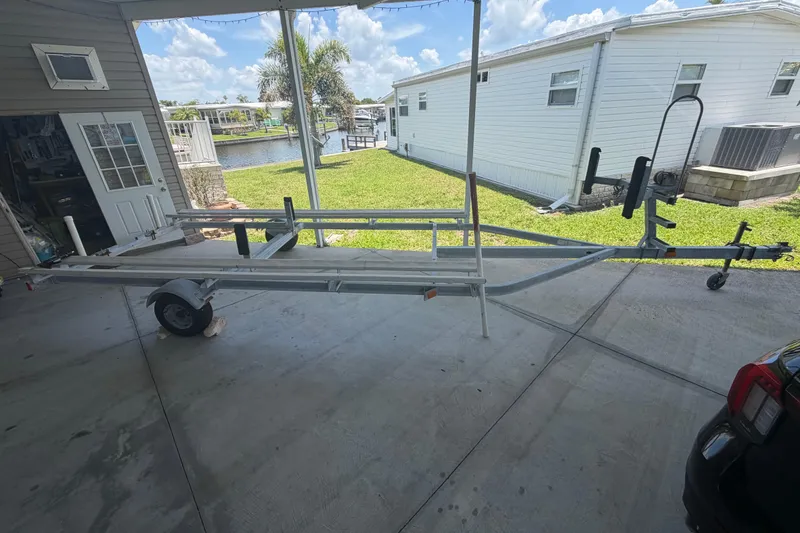 Slide: The Image of Boat trailer parked in a driveway, suitable for 2019 Sun Tracker Party Barge 20 DLX. - 25