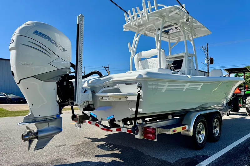 Slide: The Image of 2023 Barker Boatworks 26 Open on trailer with Mercury outboard engine. - 4