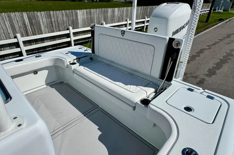 Slide: The Image of 2023 Barker Boatworks 26 Open, featuring a sleek white interior and comfortable seating. - 8