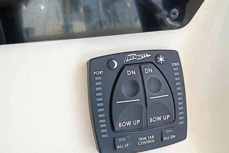 Slide: The Image of Bennett trim tab control panel on 2023 Bulls Bay 2200 boat. - 14