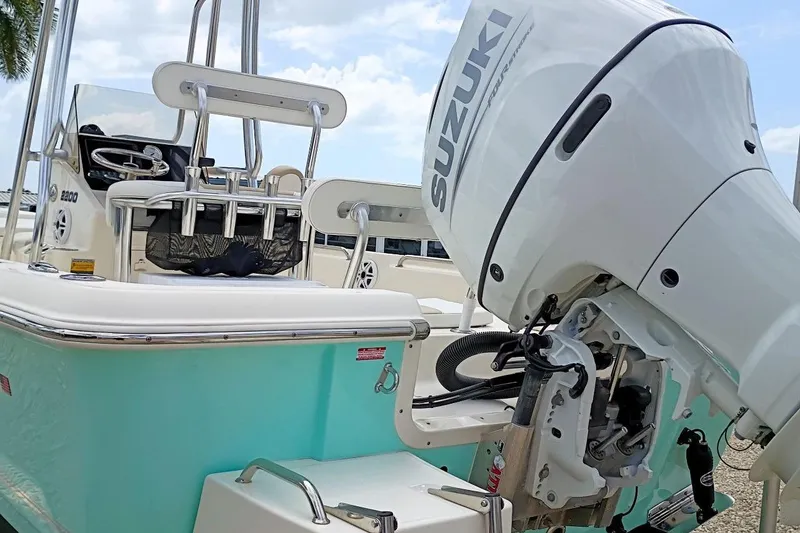 Slide: The Image of 2023 Bulls Bay 2200 boat with Suzuki outboard motor, featuring sleek design and modern amenities. - 2