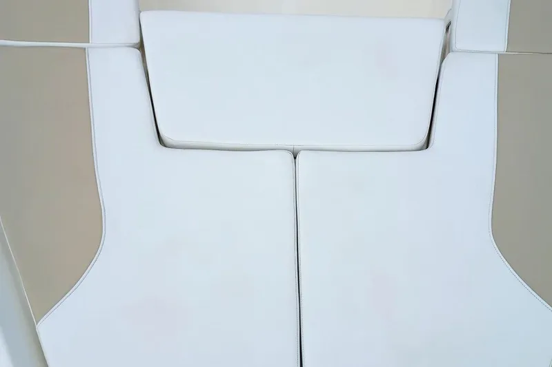 Slide: The Image of 2023 Bulls Bay 2200 boat interior with white cushioned seating. - 21