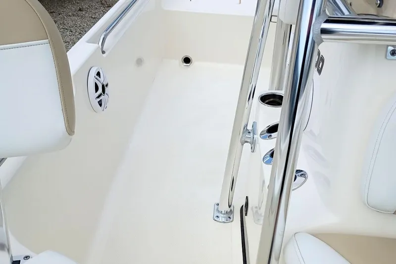 Slide: The Image of 2023 Bulls Bay 2200 boat interior with chrome railings and speaker detail. - 27
