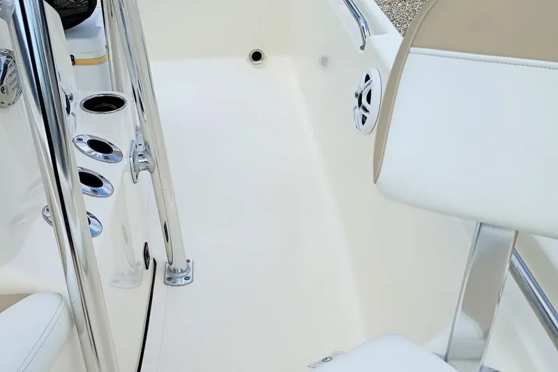 Slide: The Image of Interior view of 2023 Bulls Bay 2200 boat, featuring chrome details and white seating. - 28
