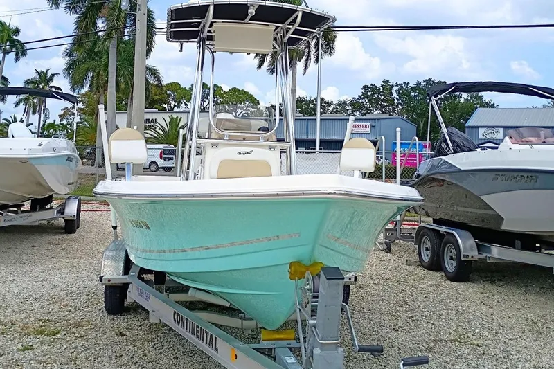 Slide: The Image of 2023 Bulls Bay 2200 boat on trailer, displayed outdoors with palm trees. - 3