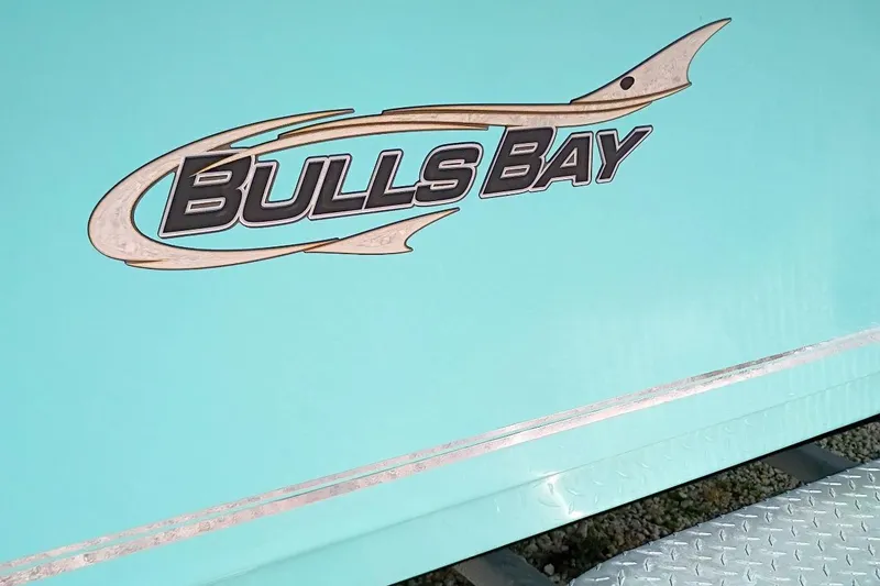 Slide: The Image of 2023 Bulls Bay 2200 logo on a turquoise boat hull. - 4