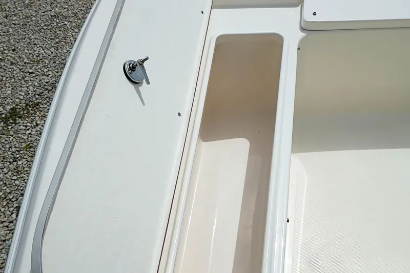 Slide: The Image of 2023 Bulls Bay 2200 boat interior with storage compartment and key lock. - 40