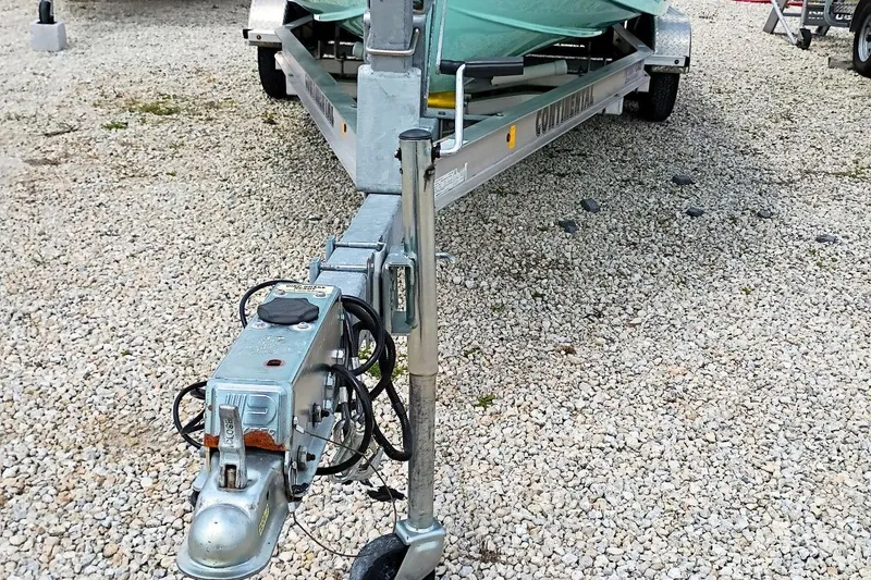 Slide: The Image of Trailer hitch of a 2023 Bulls Bay 2200 boat on gravel surface. - 48