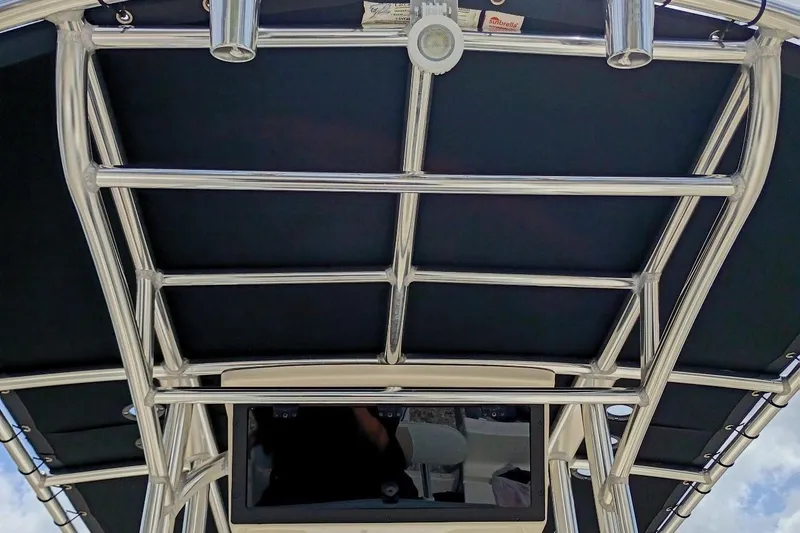 Slide: The Image of 2023 Bulls Bay 2200 boat T-top with stainless steel frame and black canvas. - 8