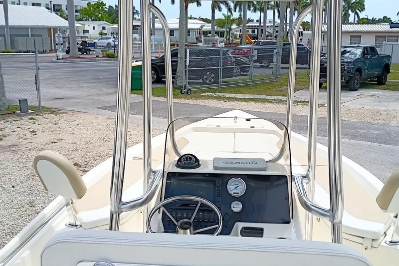 Slide: The Image of 2023 Bulls Bay 2200 boat interior with steering wheel and navigation equipment. - 9