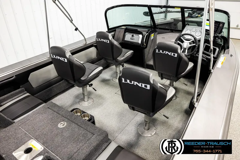 Slide: The Image of 2023 Lund 1875 Tyee boat interior with seating and steering console. - 12