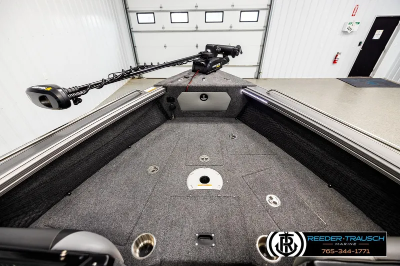 Slide: The Image of 2023 Lund 1875 Tyee boat interior with trolling motor in showroom. - 15