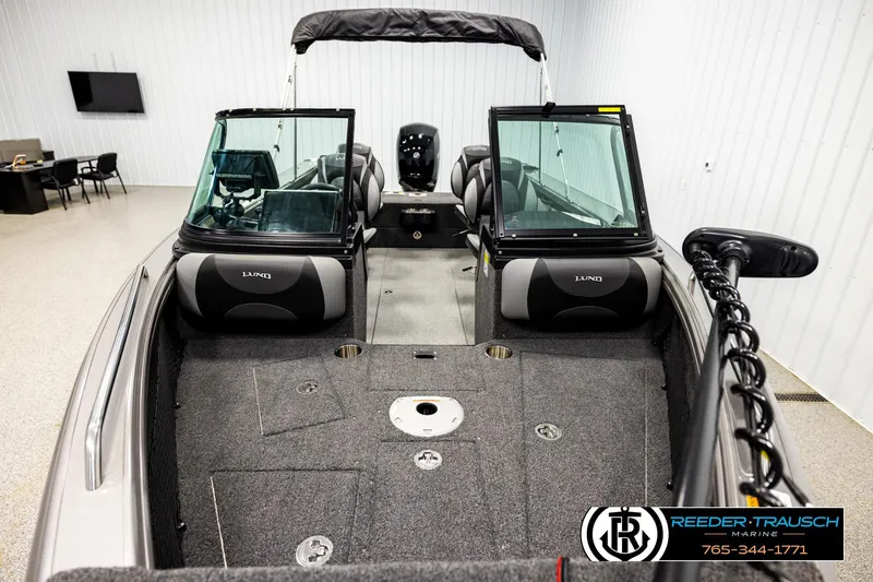 Slide: The Image of 2023 Lund 1875 Tyee boat interior with seating and equipment in showroom. - 16