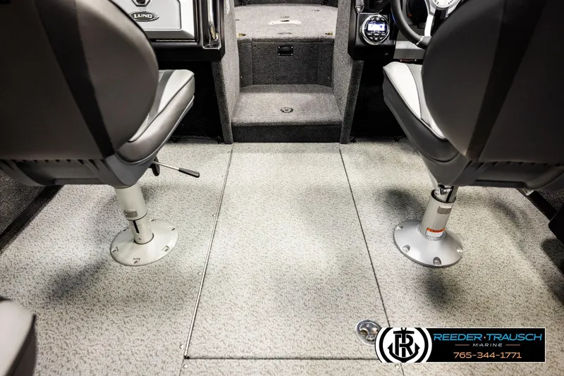 Slide: The Image of Interior of 2023 Lund 1875 Tyee boat with seating and carpeted flooring. - 22