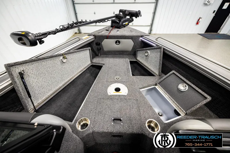 Slide: The Image of 2023 Lund 1875 Tyee boat interior with storage compartments and fishing equipment. - 27