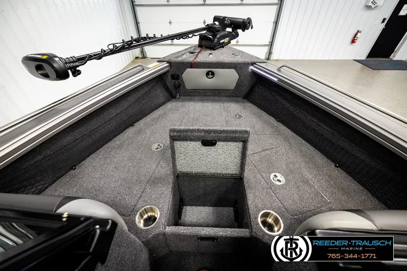 Slide: The Image of 2023 Lund 1875 Tyee boat interior with trolling motor and storage compartments. - 28