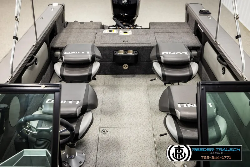 Slide: The Image of 2023 Lund 1875 Tyee boat interior with four seats and steering wheel. - 29