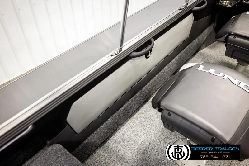 Slide: The Image of 2023 Lund 1875 Tyee boat interior with seating and storage compartments. - 31