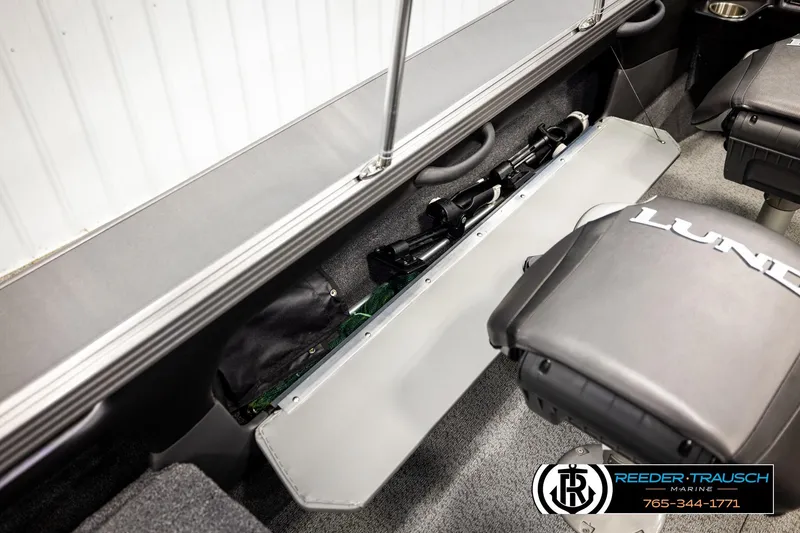 Slide: The Image of 2023 Lund 1875 Tyee boat interior with rod storage and seating. - 32
