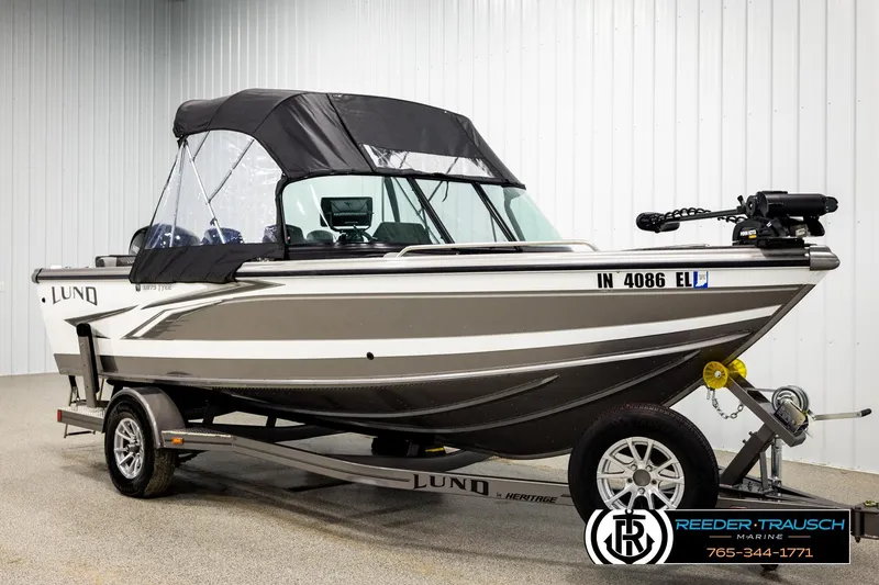Slide: The Image of 2023 Lund 1875 Tyee boat with canopy on trailer in showroom. - 4