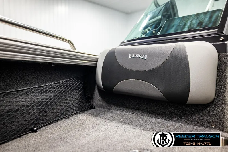Slide: The Image of 2023 Lund 1875 Tyee boat interior with padded seating and storage netting. - 45