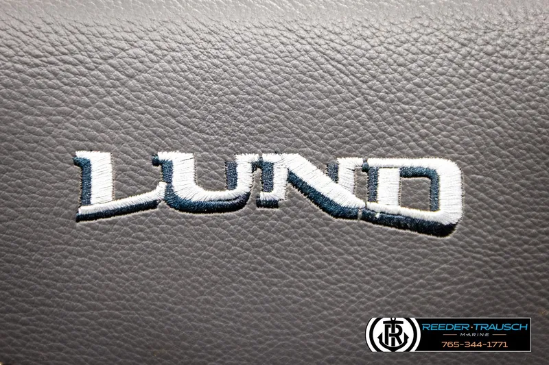 Slide: The Image of Lund 1875 Tyee 2023 logo on textured surface, Reeder-Trausch Marine branding visible. - 46