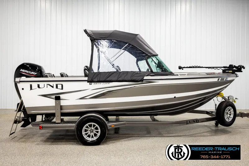 Slide: The Image of 2023 Lund 1875 Tyee boat with Mercury engine on trailer in showroom. - 5