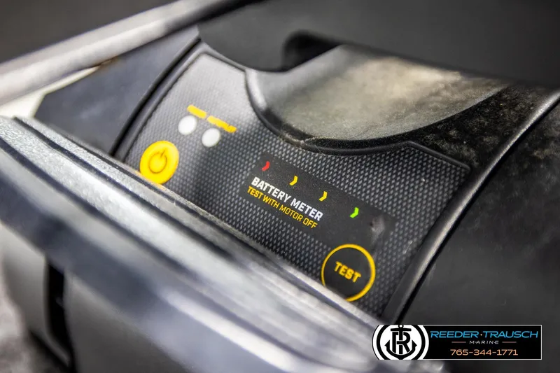 Slide: The Image of Battery meter on 2023 Lund 1875 Tyee boat dashboard, featuring test button and indicators. - 53