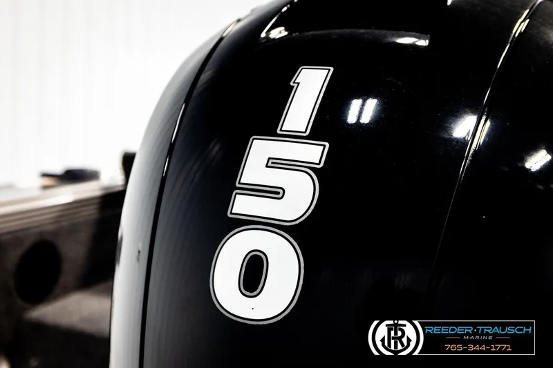 Slide: The Image of Close-up of a 2023 Lund 1875 Tyee boat engine with "150" decal. - 57
