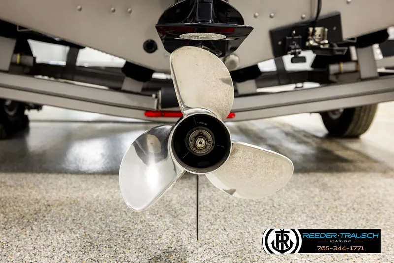 Slide: The Image of 2023 Lund 1875 Tyee boat propeller close-up in showroom setting. - 58