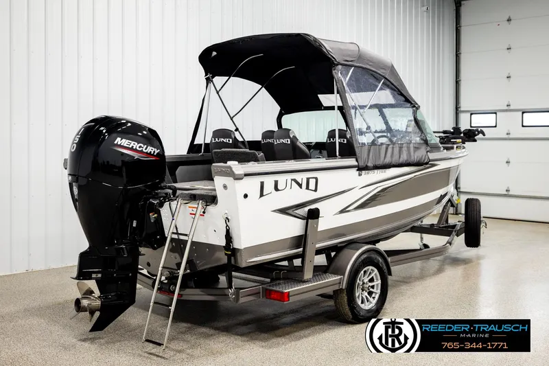Slide: The Image of 2023 Lund 1875 Tyee boat with Mercury outboard motor in showroom. - 6