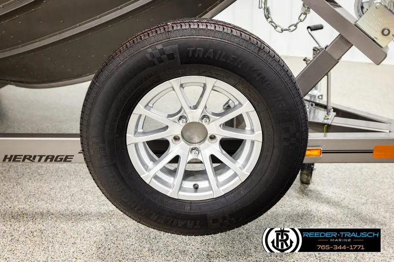 Slide: The Image of Trailer wheel of 2023 Lund 1875 Tyee boat on Heritage trailer. - 61