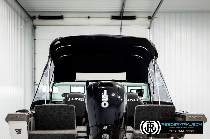 Slide: The Image of 2023 Lund 1875 Tyee boat with 150 HP engine in indoor showroom. - 7