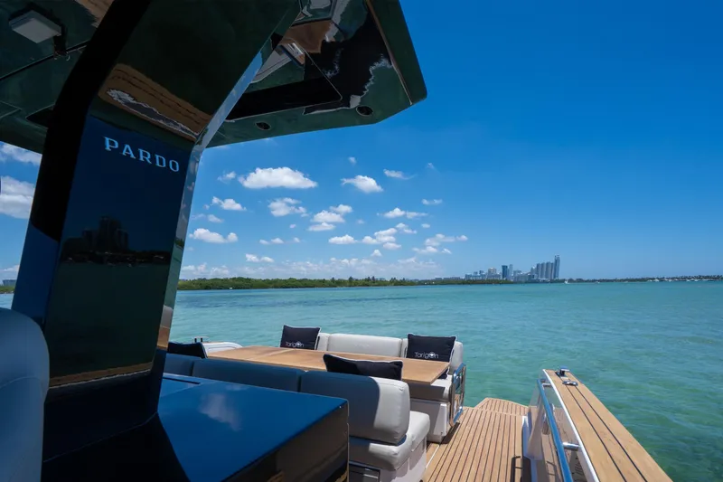Slide: The Image of Luxurious 2020 Pardo Yachts 38 cruising on clear blue waters with city skyline view. - 13